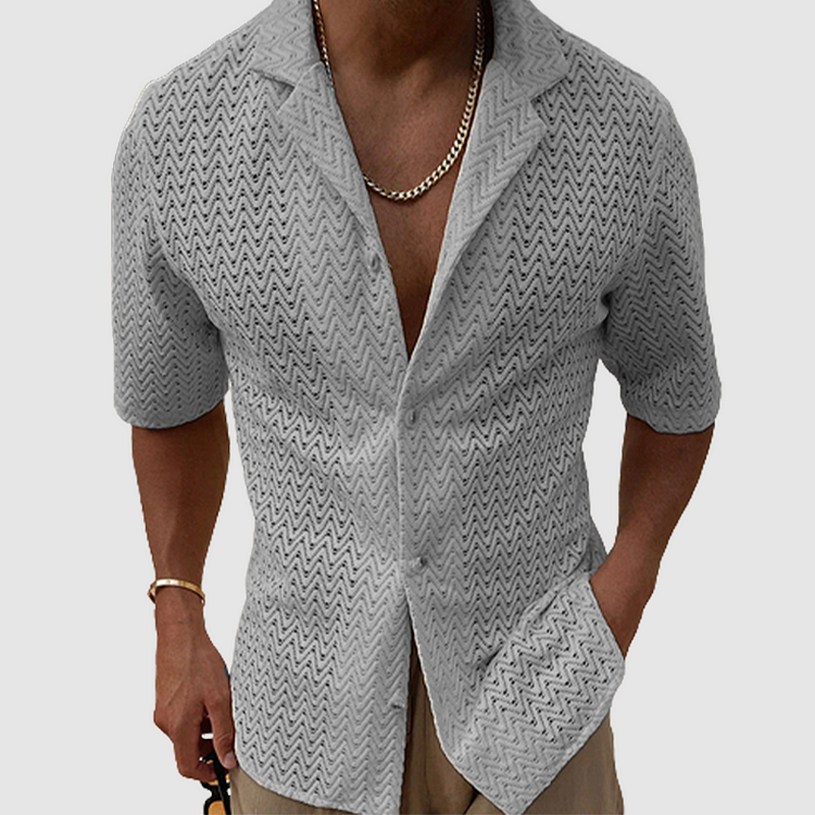 Men's short sleeve open-weave leisure shirt, designed for breathability and relaxed comfort in warm weather.