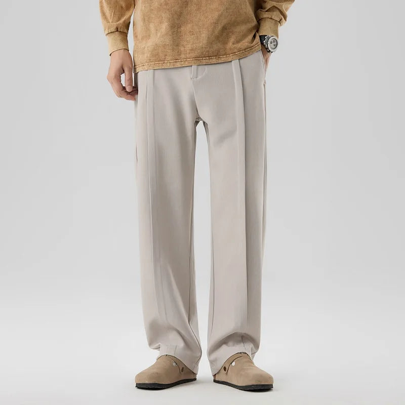 Men's Brunello drape trousers. Sophisticated pleated pants for versatile formal & casual wear.