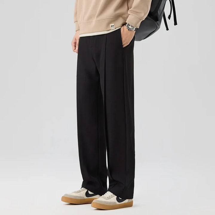 Brown men's Brunello drape trousers. Sophisticated pleated pants for a relaxed, elegant fit.