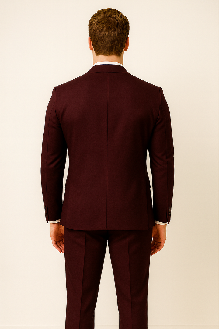 Complete men's burgundy three-piece suit, including jacket, waistcoat & trousers, for sharp formal fashion.