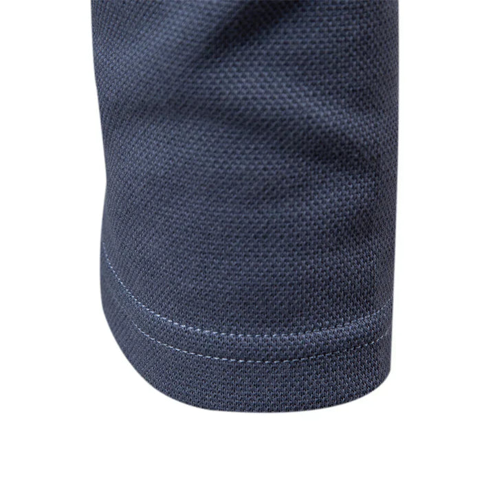Embroidered Carlton men's long-sleeve polo with turn-down collar. Smart casual essential for modern men.