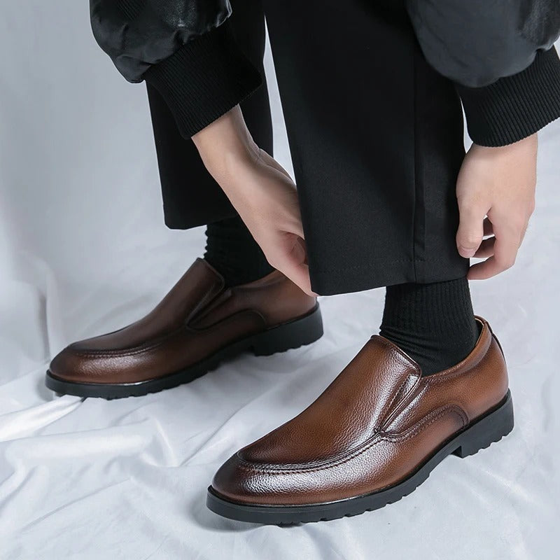 Stylish black slip-on loafers for men, offering comfort and versatility for casual and dress occasions.
