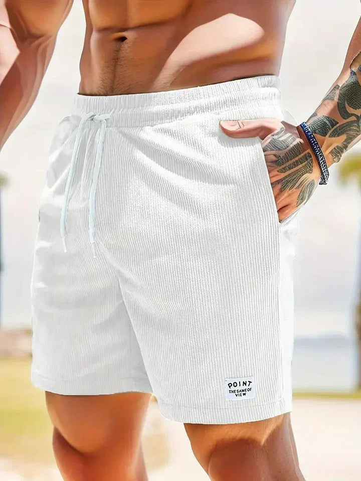 Durable men's corduroy shorts, relaxed fit, drawstring waist for casual activities.