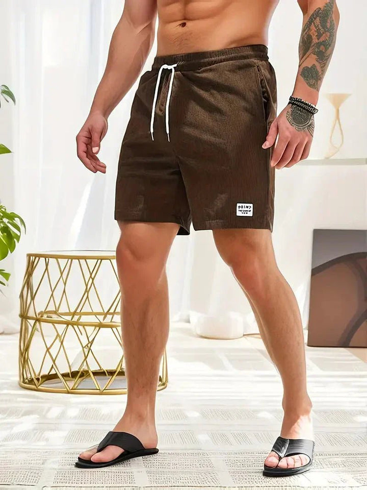 Trendy men's corduroy shorts, drawstring design, suitable for everyday and beach wear.