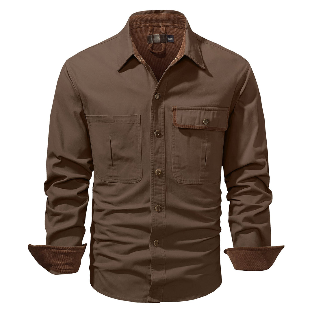 Close-up of the durable fabric on a men's cotton button-up shirt jacket, texture visible.