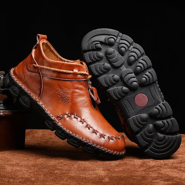 Fashionable men's casual hand-stitched leather ankle boots, essential fall winter footwear.