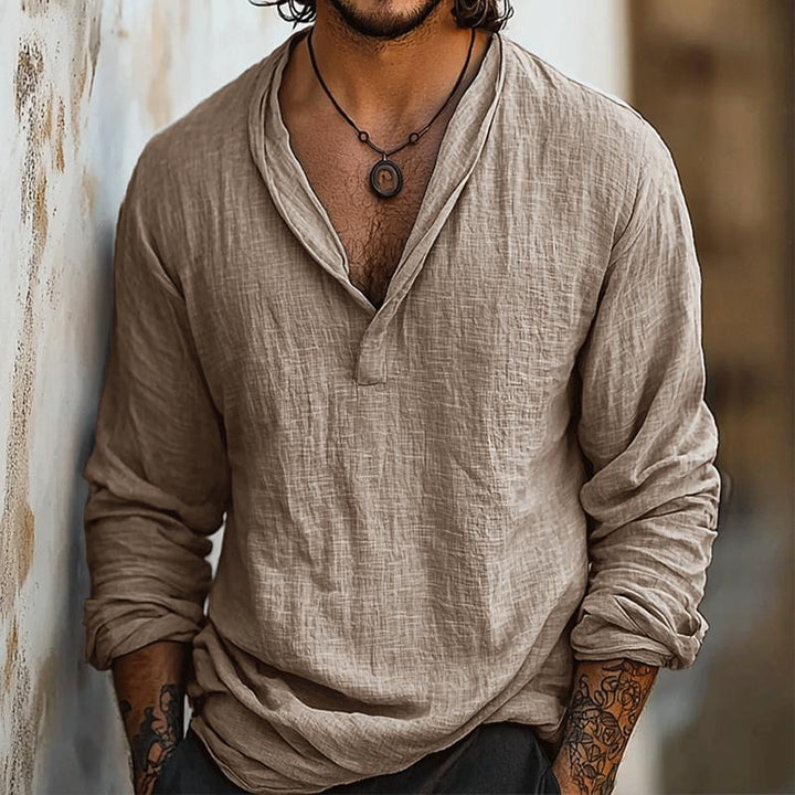 Stylish men's summer Henley shirt with long sleeves & button placket, ideal for casual relaxed wear.