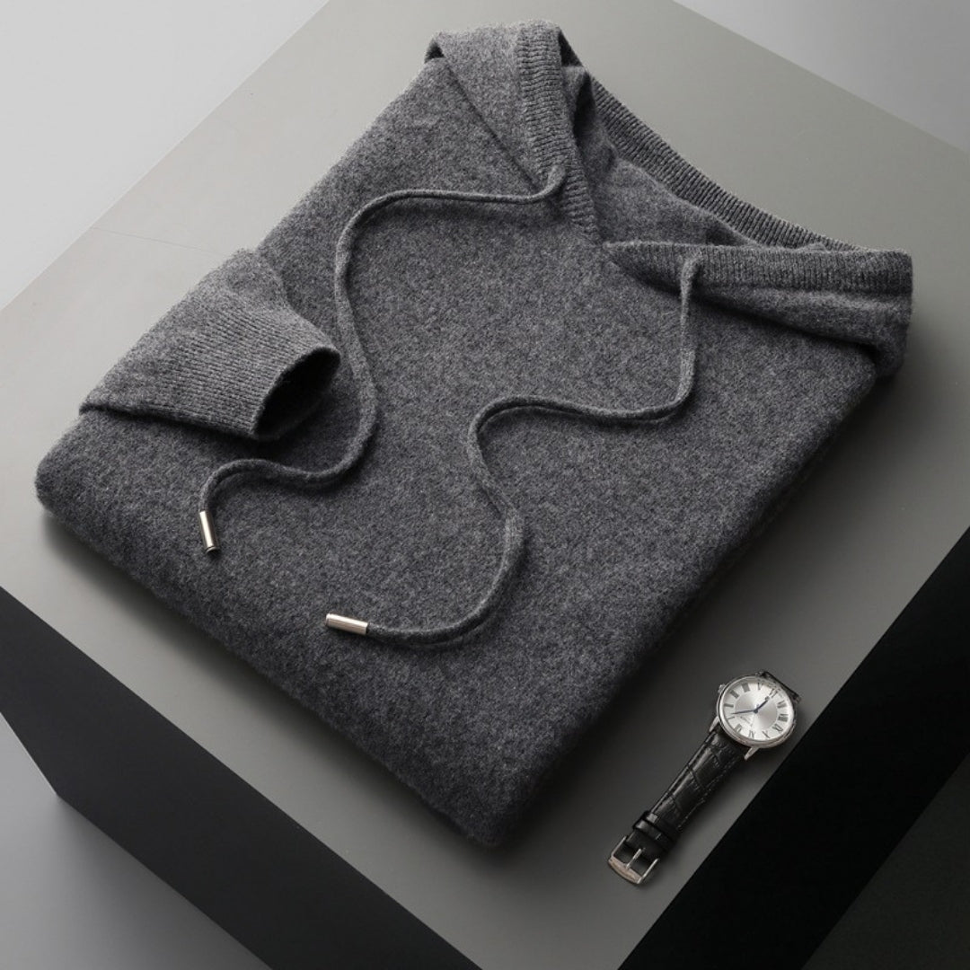 Close-up of a men's hooded knit pullover texture, showcasing quality and casual appeal.