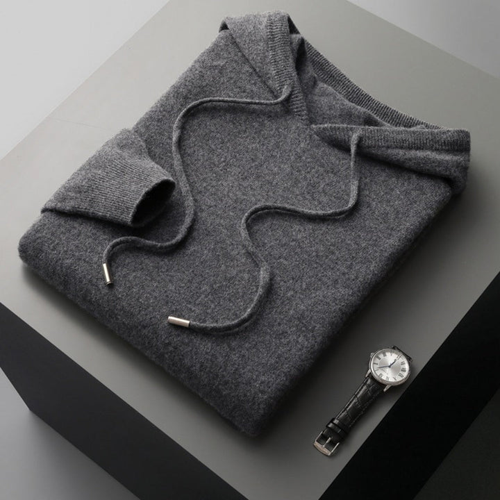Close-up of a men's hooded knit pullover texture, showcasing quality and casual appeal.