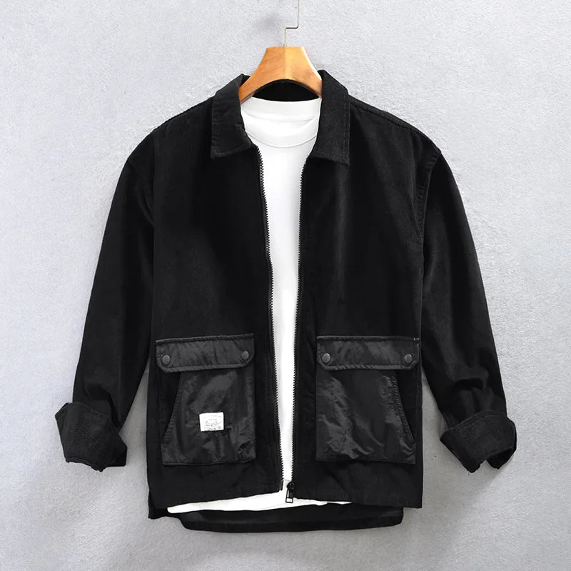 Stylish black corduroy men's jacket with a full zip, ideal for casual wear and cool weather outfits.