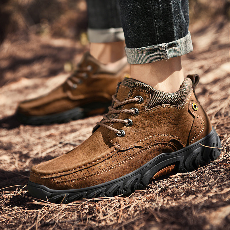 Close-up of the waterproof leather on men's short outdoor boots