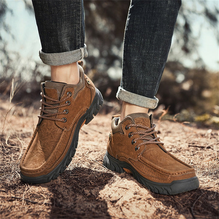 Detailed shot of the men's leather work boots' stitching and texture