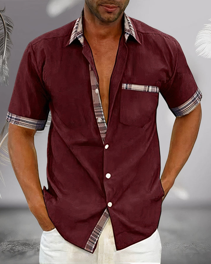 Modern men's short-sleeve button-down shirt featuring plaid accents, perfect for a contemporary look.