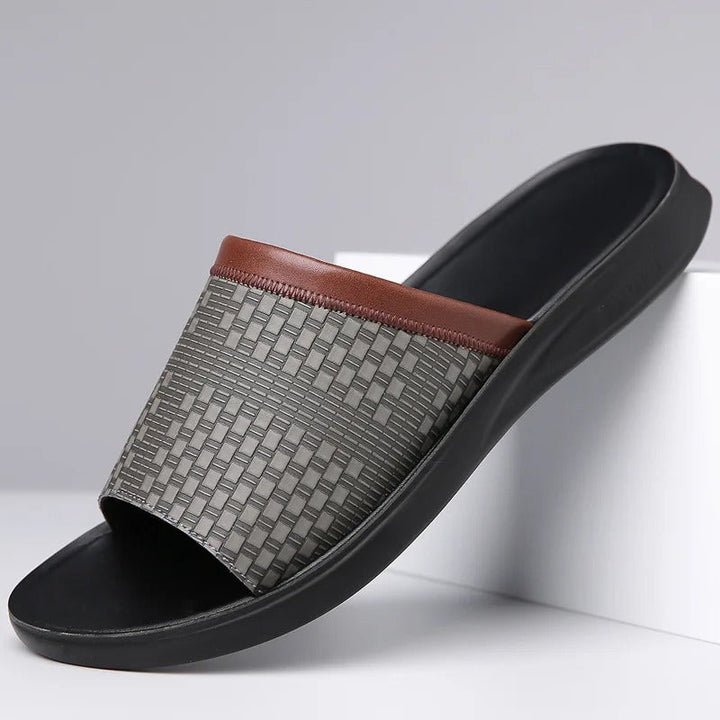 Close-up of men's slip-on sandals, showcasing comfortable footbed and open toe design