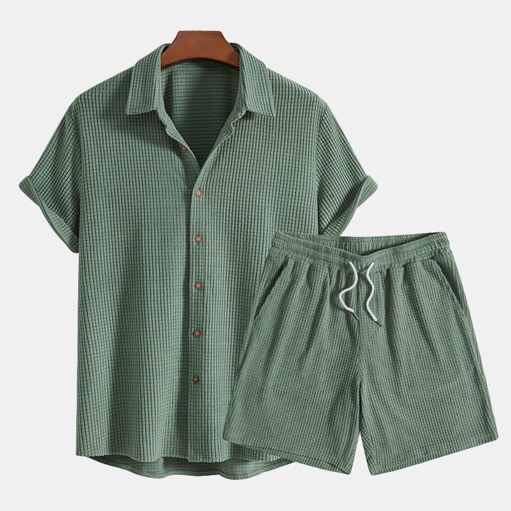 Textured men's casual 2 piece summer set with short sleeve shirt & drawstring shorts.