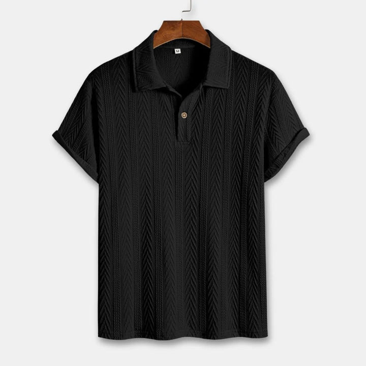 Stylish men's short-sleeve polo shirt featuring a distinctive chevron textured pattern, suitable for casual wear.
