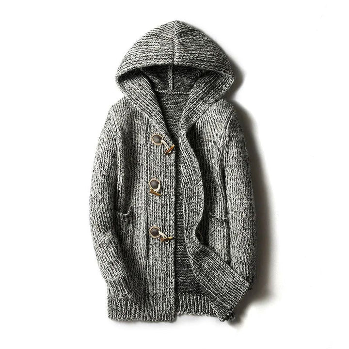 Close-up of a men's chunky knit hooded cardigan, highlighting the detailed knitwear and comfortable fabric.