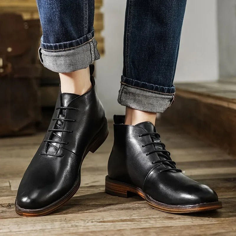 Overhead shot of men's leather dress boots, highlighting the sleek design.