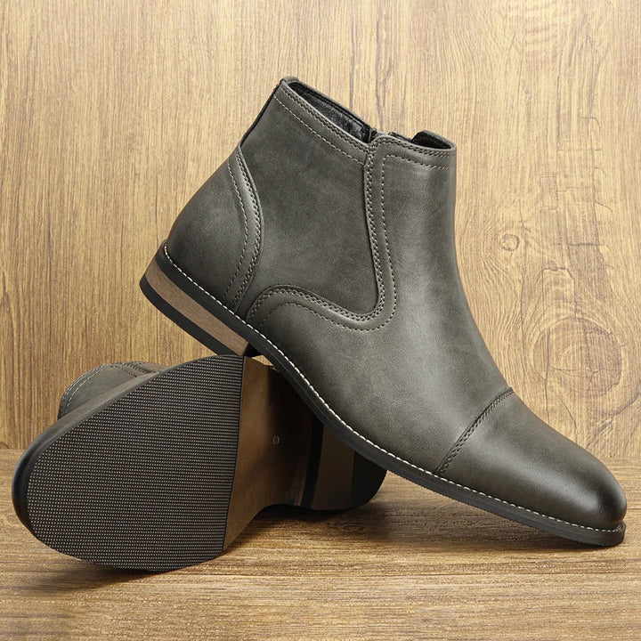 Brown men's Chelsea boots featuring a convenient side-zip closure, perfect for everyday and formal outfits.