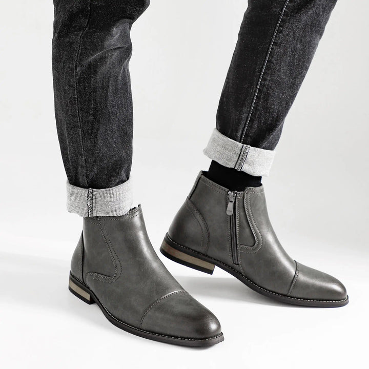 Top-down view of men's black side-zip Chelsea boots, showcasing their sleek design and quality craftsmanship.