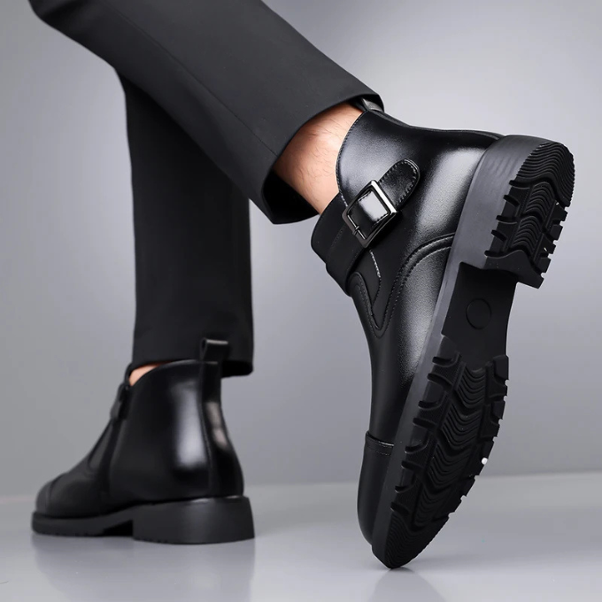 Sophisticated men's brown Chelsea boots, suitable for office wear or a refined casual ensemble.
