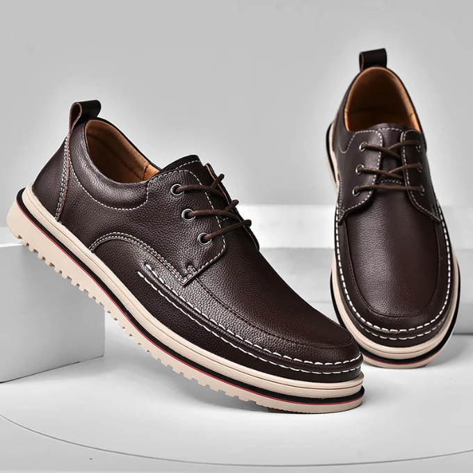 Side profile of men's dark brown leather moc-toe Derby shoes, focusing on comfort and style.