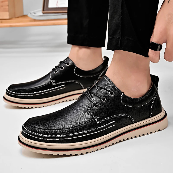 Detailed shot of the lacing on black men's moc-toe Derby shoes, emphasizing craftsmanship.