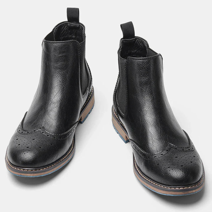 Close-up of a men's classic slip-on Chelsea boot, highlighting the quality leather and sleek design.