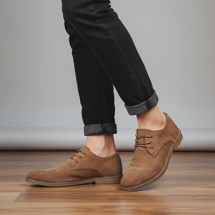 Men's classic black oxford lace-up dress shoes, perfect for formal and business occasions.