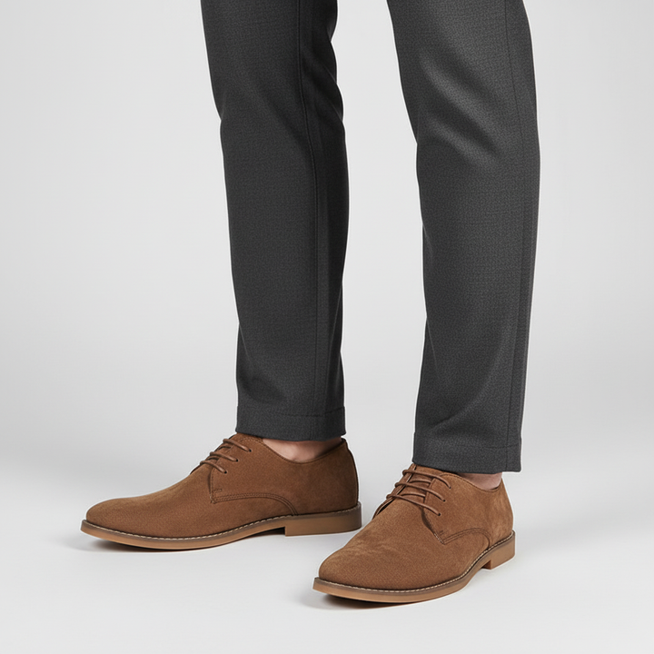 Polished black men's oxford dress shoes with lace-up detail, essential classic formal footwear.