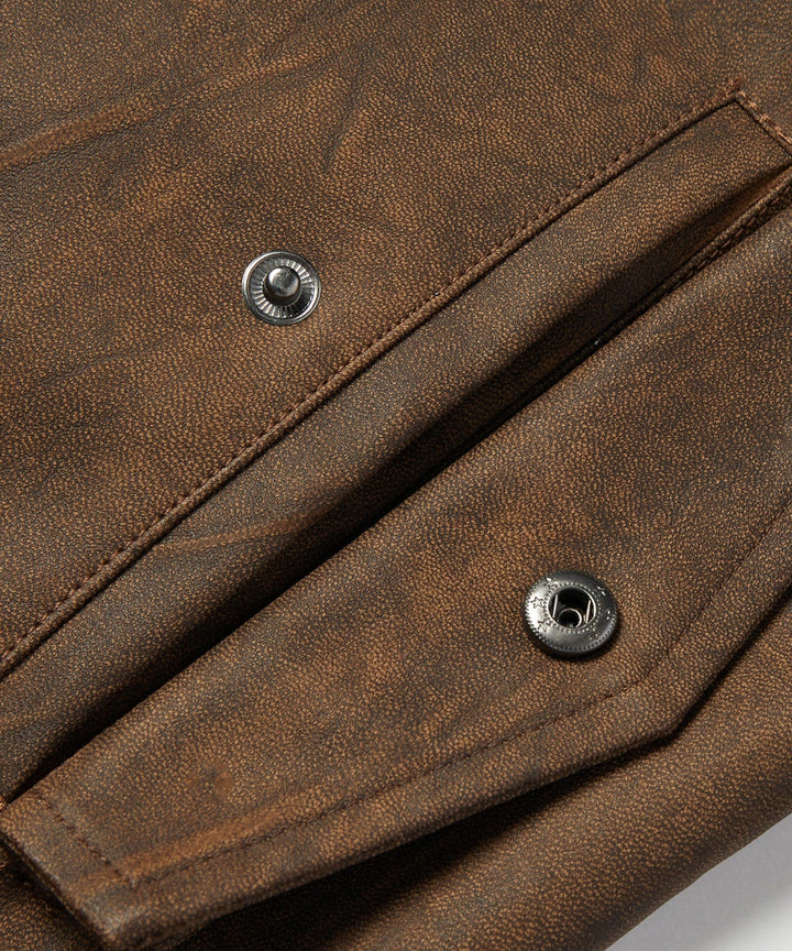 Handsome man wearing a classic PU leather drifter jacket, paired with jeans, exuding casual sophistication.