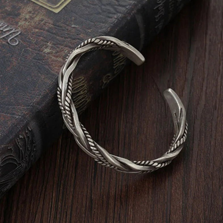 Versatile men's sterling silver braided cuff bracelet, an elegant open cuff for daily wear or special occasions.