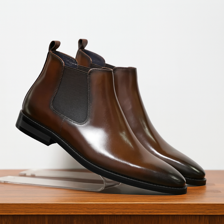 Men's classic brown leather Chelsea boots, perfect for casual or dress wear, with elastic side panels.