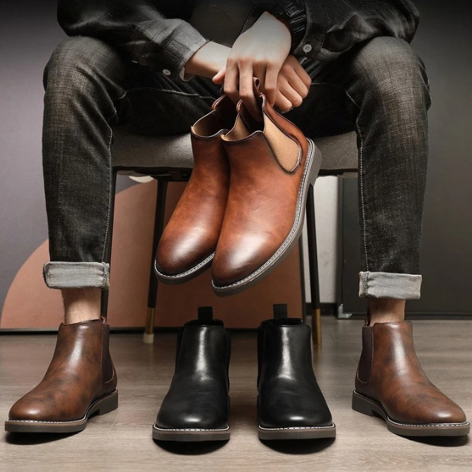 Group shot: brown and black men's leather Chelsea boots, showcasing color options.