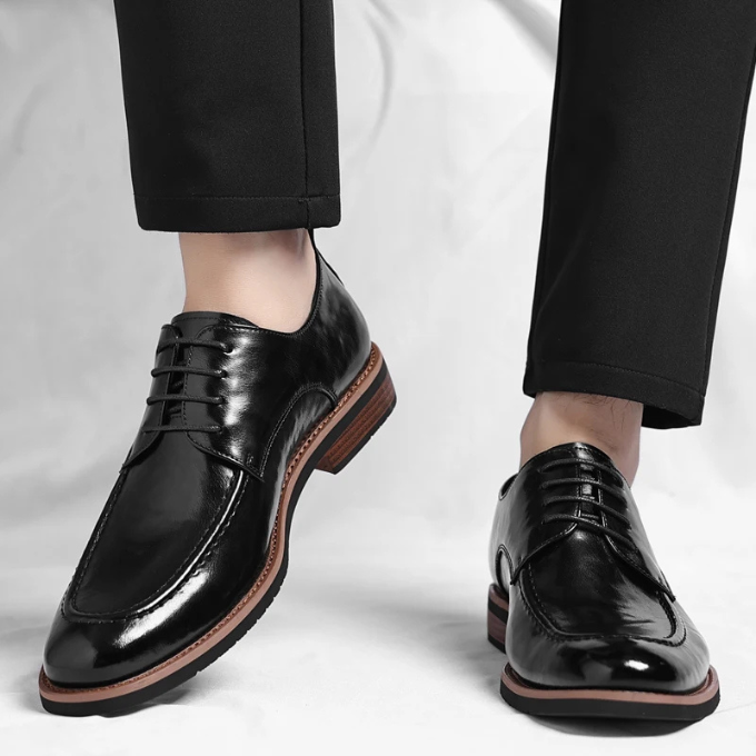 Polished brown leather Oxford dress shoes for men, designed for comfort and enduring classic style.