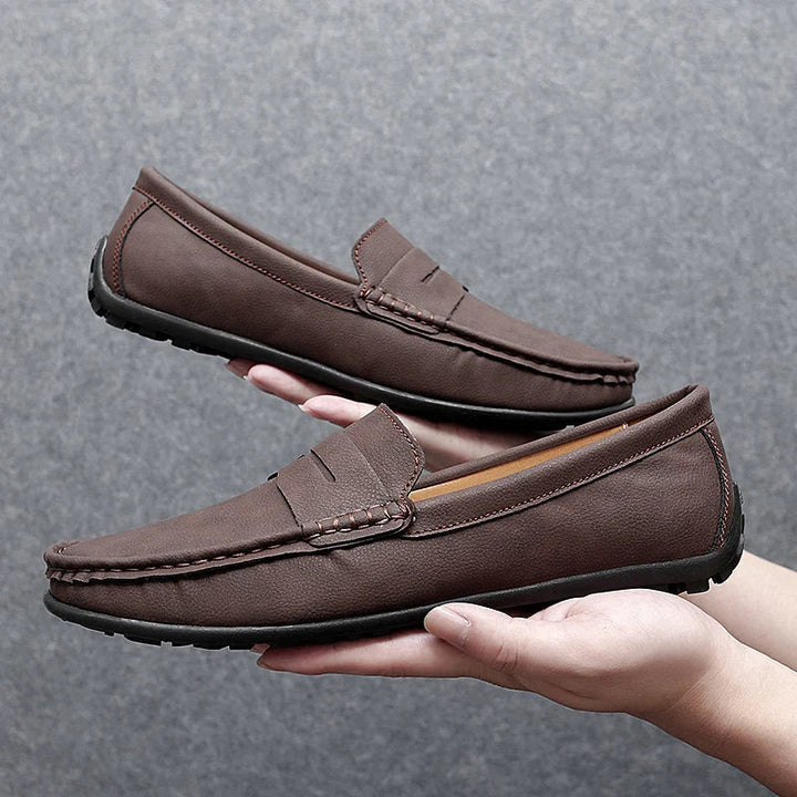 Traditional men's leather penny loafers, embodying classic men's fashion.