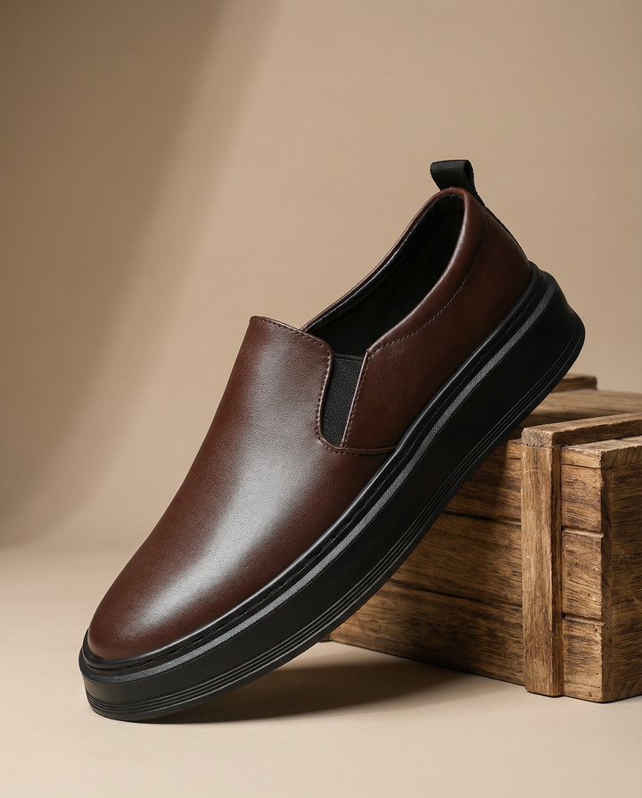 Stylish black leather slip-on loafers for men, offering easy wear and durable casual footwear