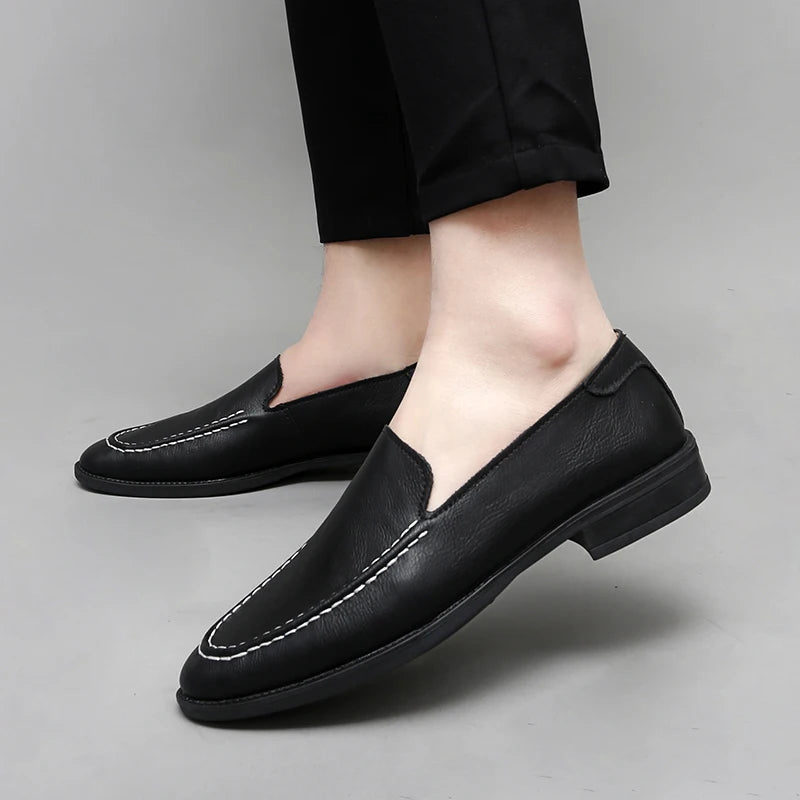 Stylish men's leather slip-on loafers in a rich tan color, versatile footwear
