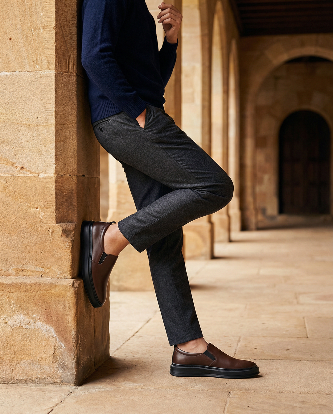 Side view of a men's black leather slip-on loafer, highlighting the sleek design and durability