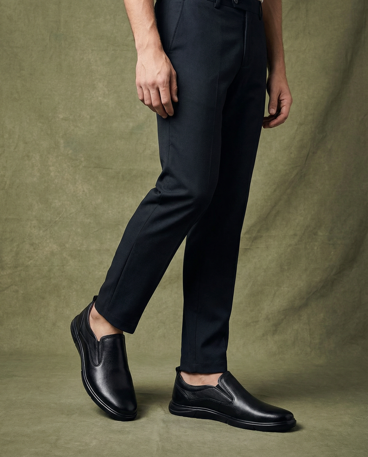 Front view of men's leather slip-on loafers, highlighting their easy-to-wear design.