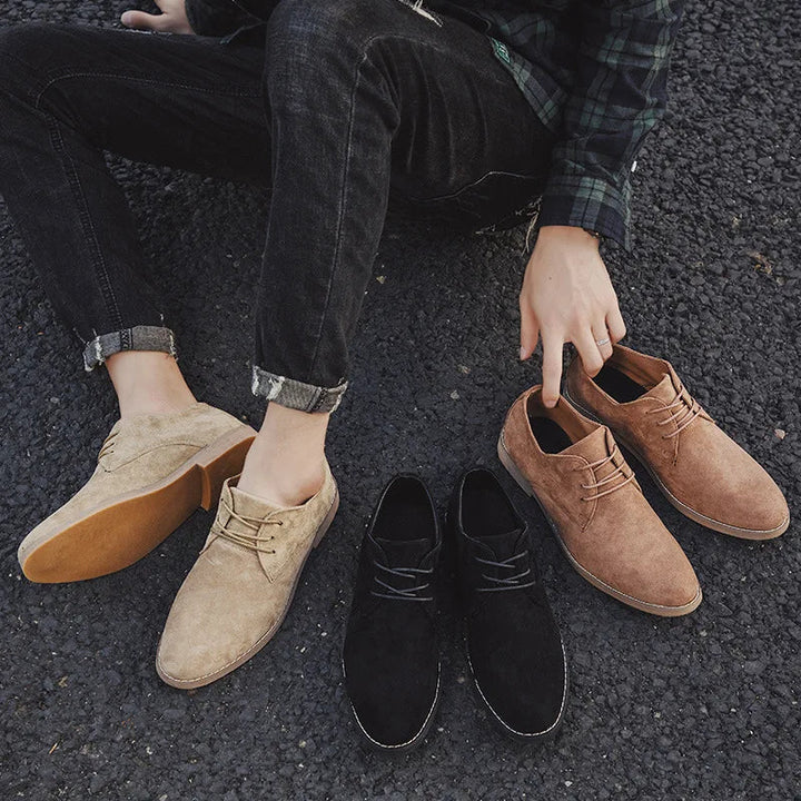 High-angle view of men's contemporary olive green suede Oxford shoes for casual and formal attire.