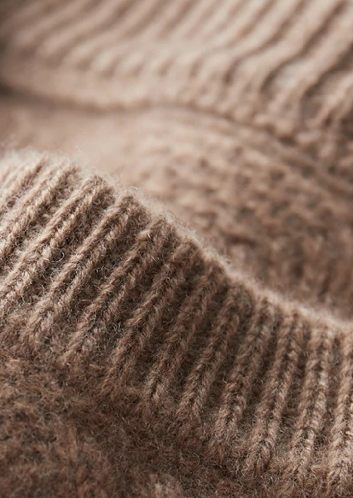 Comfortable men's cable knit crew neck sweater, ideal for stylish and warm casual layering.