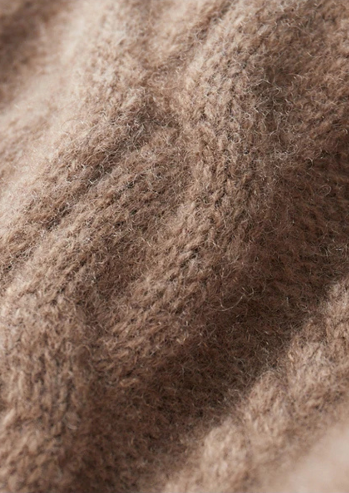 Stylish winter men's cable knit sweater, a warm crew neck casual knit for men's apparel.