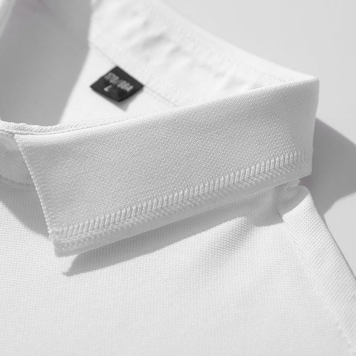 Side view of a men's classic casual polo, showing short sleeve and relaxed fit