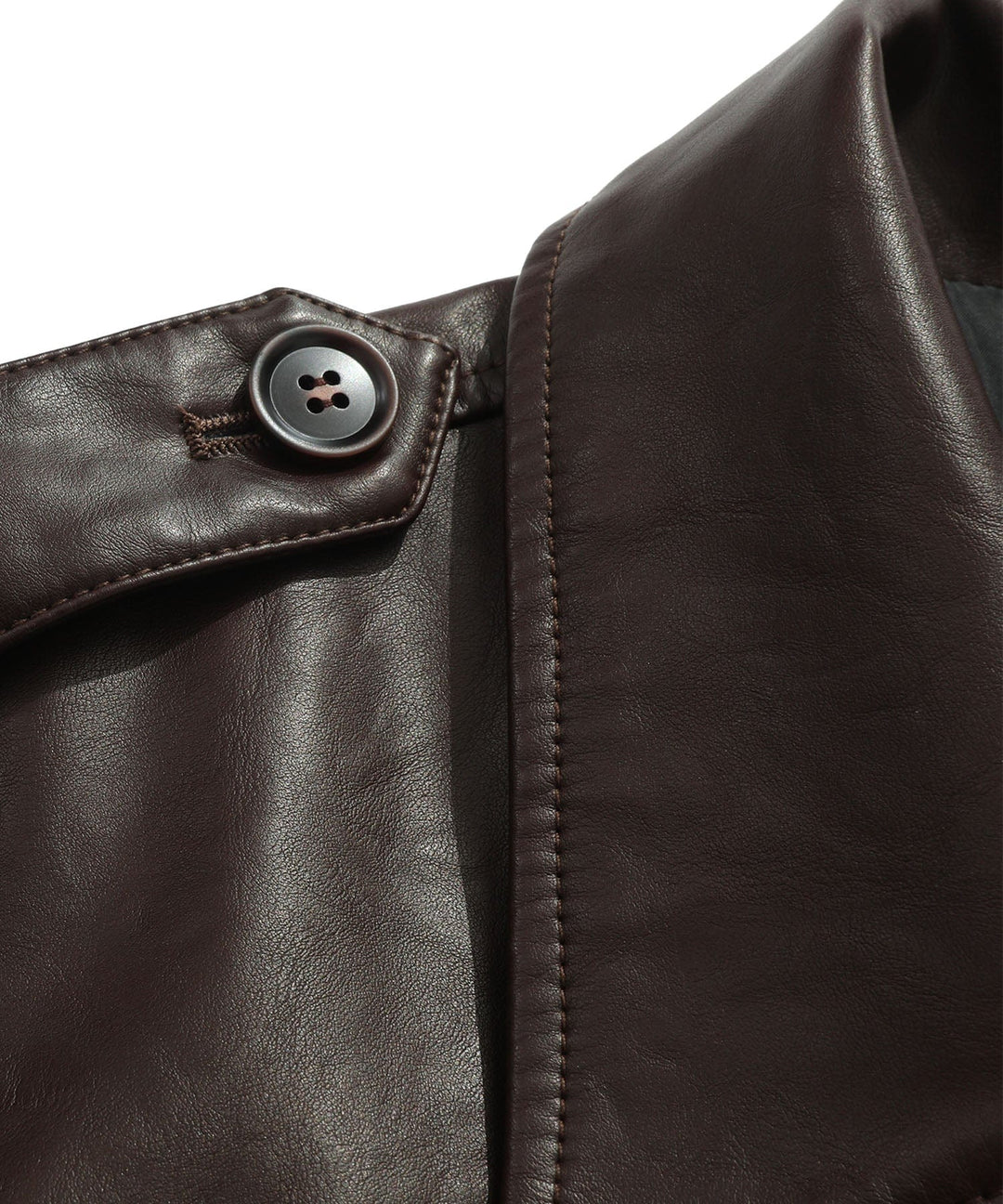 Man posing in a coffee faux leather jacket, showcasing classic men's apparel