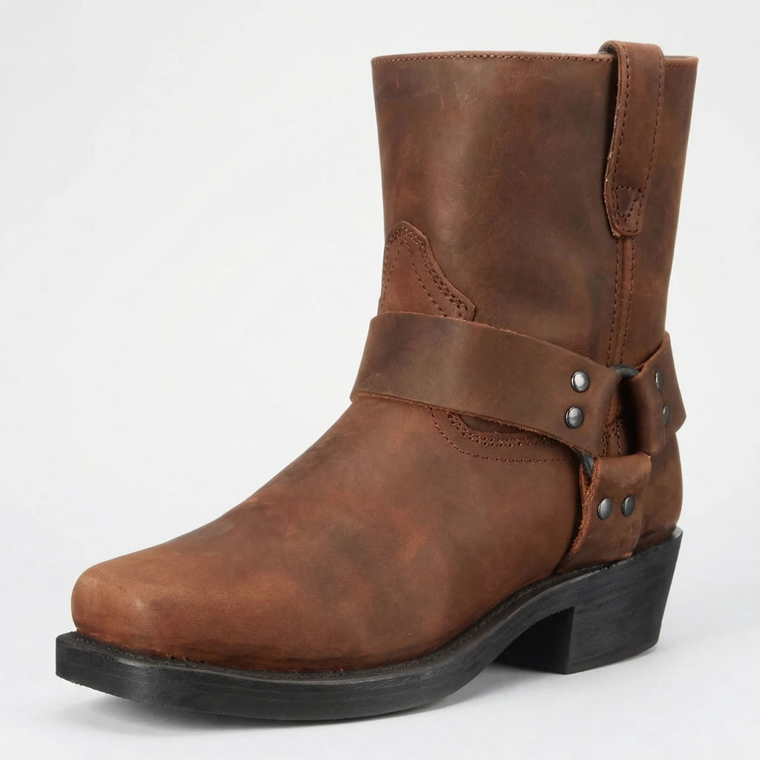 Stylish men's slip-on cowboy boots featuring a distinctive studded strap for authentic western fashion.