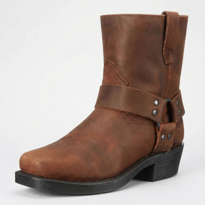 Stylish men's slip-on cowboy boots featuring a distinctive studded strap for authentic western fashion.