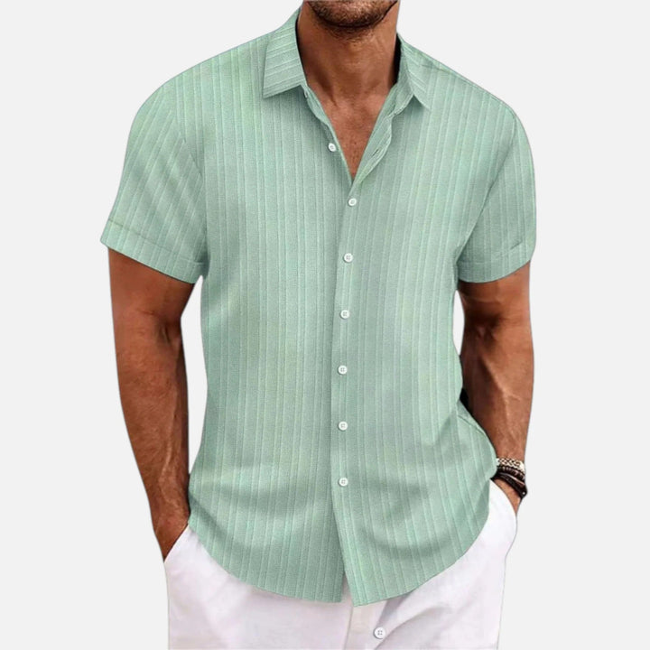 Classic men's short sleeve polo with button front & collared neck. Comfortable, smart casual everyday style.
