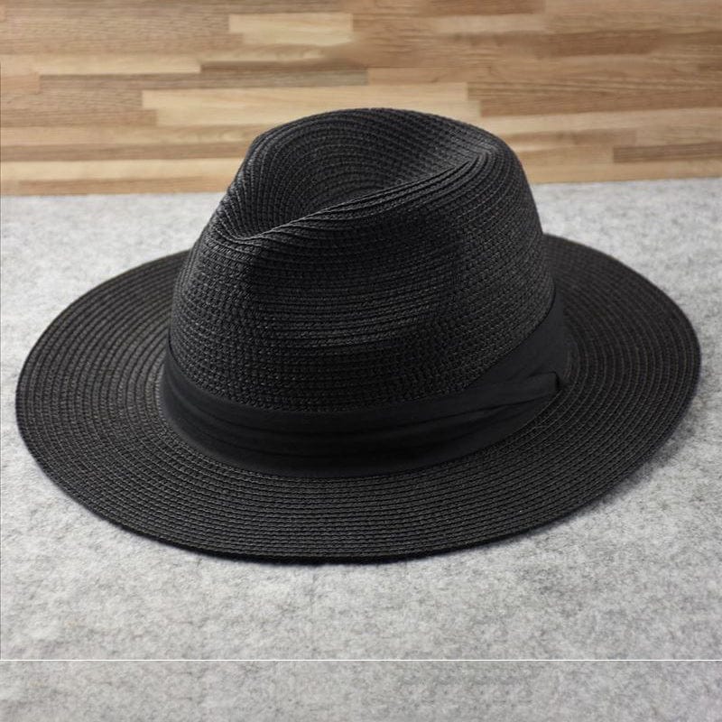 Man wearing a classic Panama hat, enjoying summer outdoor activities with UV sun protection.
