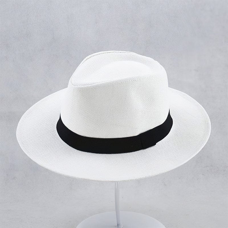 Close-up of a handmade men's Panama hat, showcasing natural straw texture & classic black band.